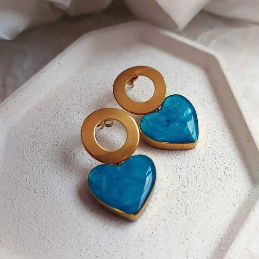 Elegantne mindjuse od hirurskog celika sa tirkiznim srcem.